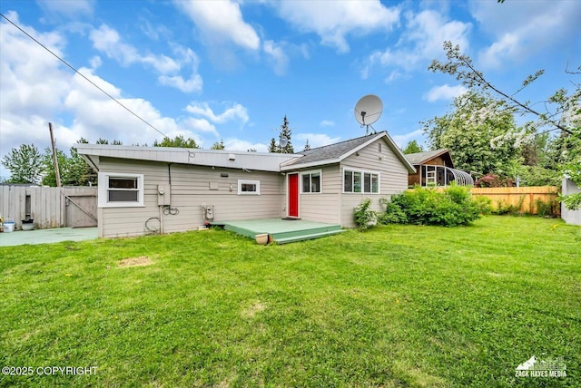 4313 Lois Dr, Anchorage, AK 99517 - back of house featuring a deck and a gate