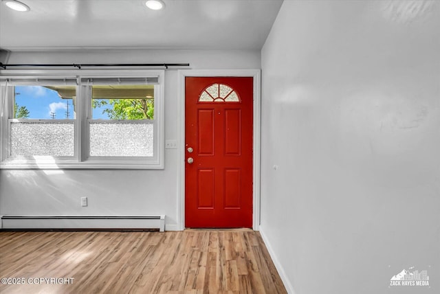 4313 Lois Dr, Anchorage, AK 99517 - entrance foyer featuring baseboard heating, light wood finished floors, baseboards, and recessed lighting