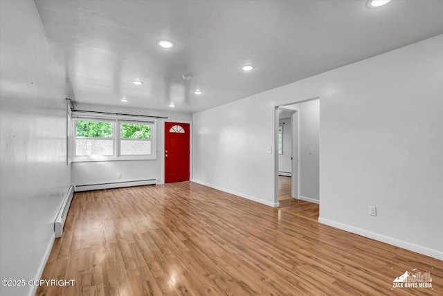 4313 Lois Dr, Anchorage, AK 99517 - empty room with light wood-style flooring, recessed lighting, baseboards, and baseboard heating