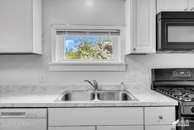 4313 Lois Dr, Anchorage, AK 99517 - kitchen with black appliances, a sink, and white cabinets