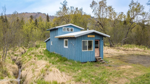 55851 Glenn Rd, Homer, AK 99603 - view of outbuilding with a wooded view and entry steps