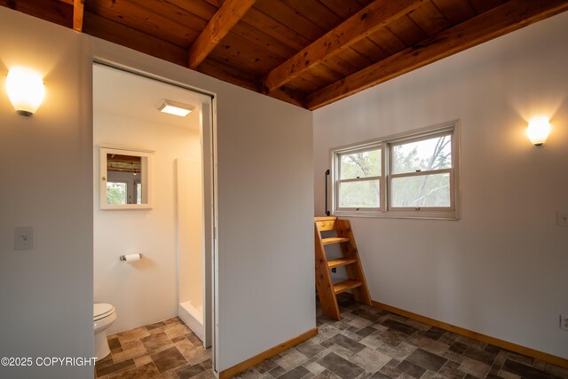 55851 Glenn Rd, Homer, AK 99603 - full bathroom featuring wood ceiling with exposed beams, stone finish floors, toilet, a shower, and baseboards
