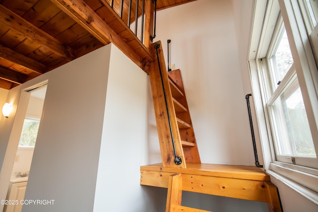 55851 Glenn Rd, Homer, AK 99603 - staircase with wooden ceiling with exposed beams