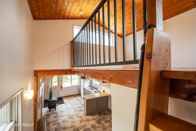 55851 Glenn Rd, Homer, AK 99603 - staircase with wooden ceiling, lofted ceiling, and baseboards