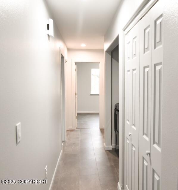 41485 Derks Lake Rd, Soldotna, AK 99669 - hall with light tile patterned floors, baseboards, and recessed lighting