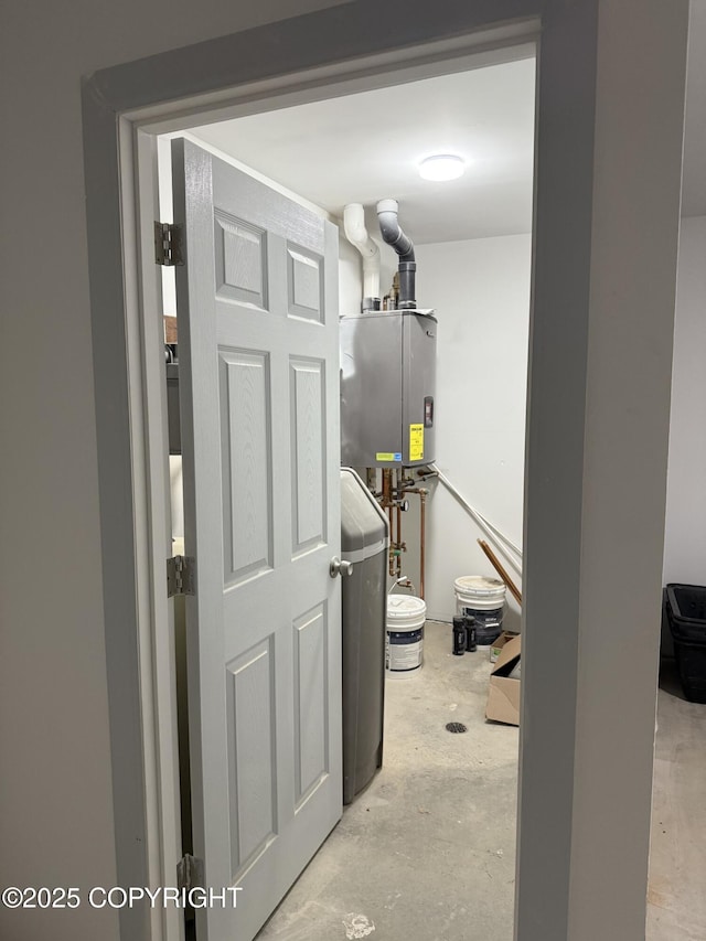 41485 Derks Lake Rd, Soldotna, AK 99669 - hallway featuring unfinished concrete flooring and water heater