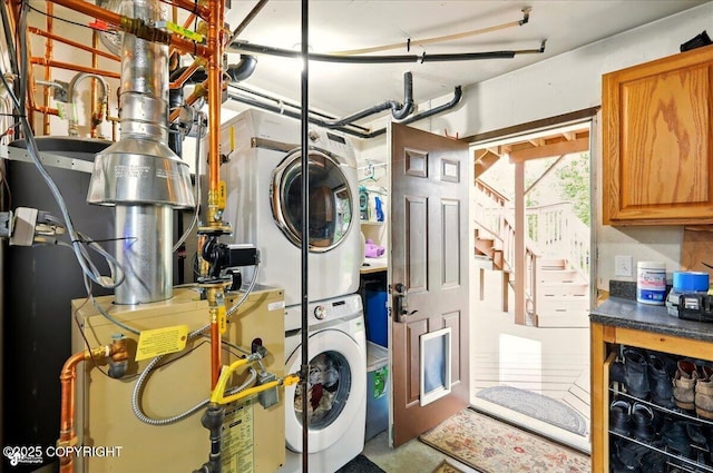 664 E Auklet Ave, Palmer, AK 99645 - laundry area featuring estacked washer and dryer and water heater