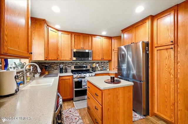 664 E Auklet Ave, Palmer, AK 99645 - kitchen featuring appliances with stainless steel finishes, a sink, light countertops, tasteful backsplash, and recessed lighting