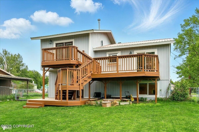 664 E Auklet Ave, Palmer, AK 99645 - back of house featuring a wooden deck, stairway, and metal roof