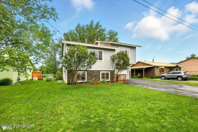 664 E Auklet Ave, Palmer, AK 99645 - view of front facade with driveway and a front lawn