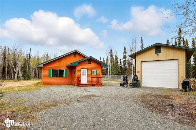 37111 Chinook St, Soldotna, AK 99669 - chalet / cabin featuring driveway, log veneer siding, and a detached garage
