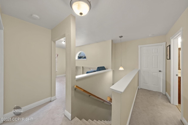 9224 Geese Cir, Eagle River, AK 99577 - hall featuring an upstairs landing, light carpet, baseboards, and healthy amount of natural light
