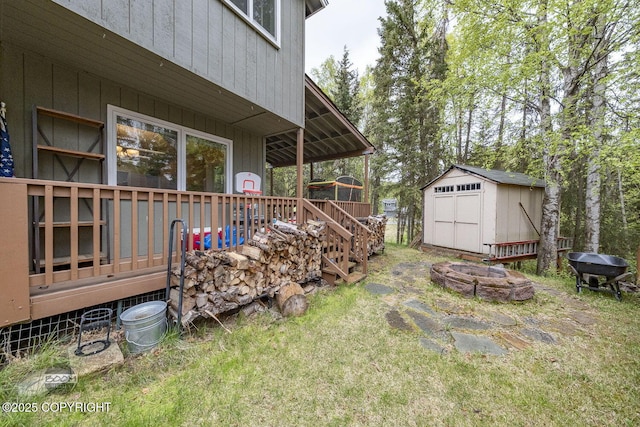 9224 Geese Cir, Eagle River, AK 99577 - view of grassy yard with an outdoor fire pit, a deck, and stairs