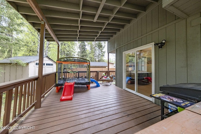9224 Geese Cir, Eagle River, AK 99577 - wooden deck with a trampoline