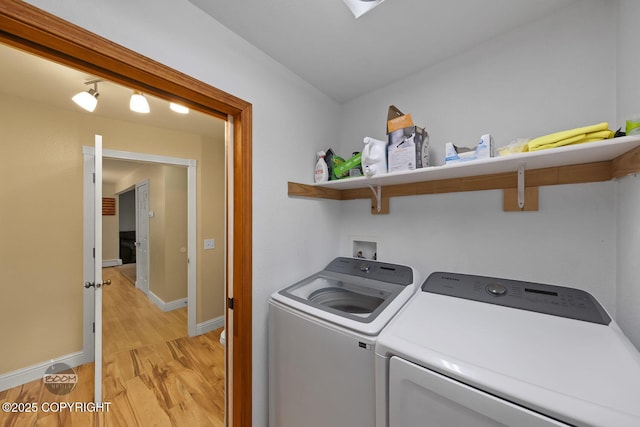 9224 Geese Cir, Eagle River, AK 99577 - laundry area with independent washer and dryer, light wood-type flooring, and baseboards