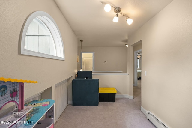 9224 Geese Cir, Eagle River, AK 99577 - hallway featuring a baseboard heating unit and carpet floors