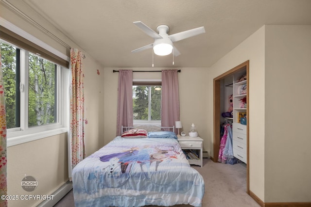 9224 Geese Cir, Eagle River, AK 99577 - carpeted bedroom featuring a baseboard heating unit and ceiling fan