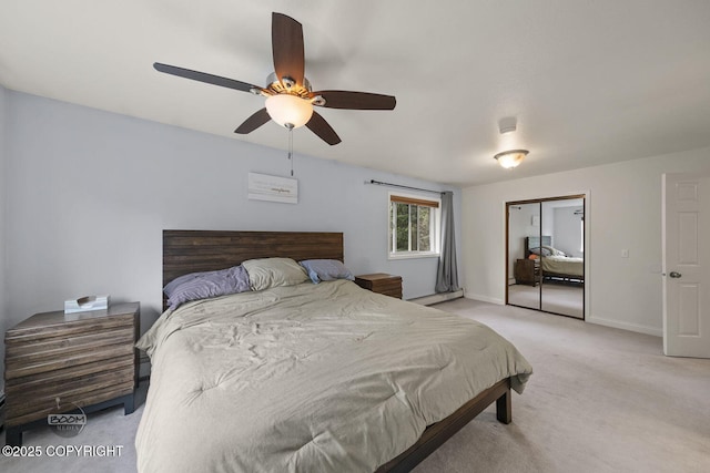 9224 Geese Cir, Eagle River, AK 99577 - bedroom featuring light colored carpet, a baseboard heating unit, a closet, baseboards, and ceiling fan