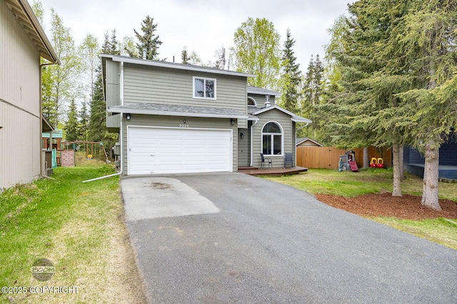 9224 Geese Cir, Eagle River, AK 99577 - view of front of home with asphalt driveway, a garage, and a shingled roof