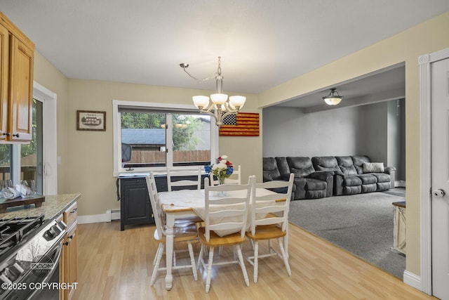 9224 Geese Cir, Eagle River, AK 99577 - dining space with a chandelier, light wood-style floors, a baseboard radiator, and baseboards