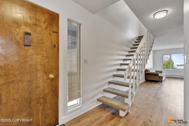 832 O Pl Unit 832, Anchorage, AK 99501 - staircase with wood finished floors and baseboards