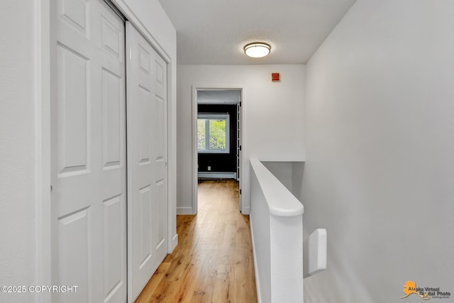 832 O Pl Unit 832, Anchorage, AK 99501 - hall with light wood-style flooring and a baseboard heating unit