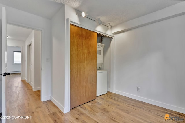 832 O Pl Unit 832, Anchorage, AK 99501 - unfurnished bedroom with light wood-type flooring, a closet, and baseboards