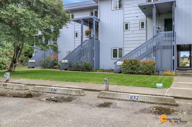832 O Pl Unit 832, Anchorage, AK 99501 - view of building exterior featuring stairway