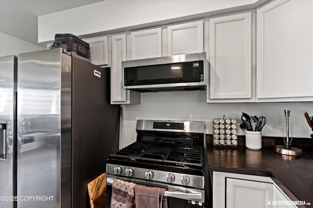 437 E 14th Ave, Anchorage, AK 99501 - kitchen featuring appliances with stainless steel finishes and white cabinets