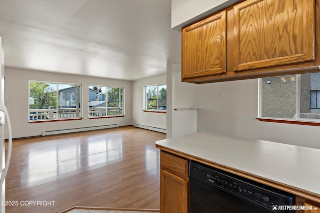 437 E 14th Ave, Anchorage, AK 99501 - kitchen with black dishwasher, a baseboard radiator, baseboard heating, light wood-style flooring, and brown cabinets
