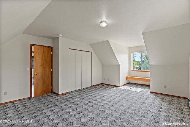 437 E 14th Ave, Anchorage, AK 99501 - additional living space featuring carpet floors, vaulted ceiling, and baseboards