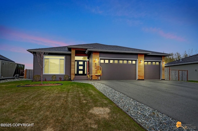 6033 Heather Wood Cir, Anchorage, AK 99502 - prairie-style home with asphalt driveway and an attached garage