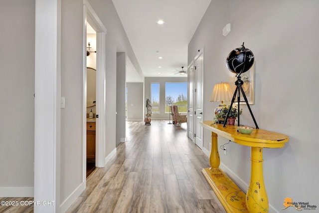 6033 Heather Wood Cir, Anchorage, AK 99502 - corridor with light wood finished floors, baseboards, and recessed lighting