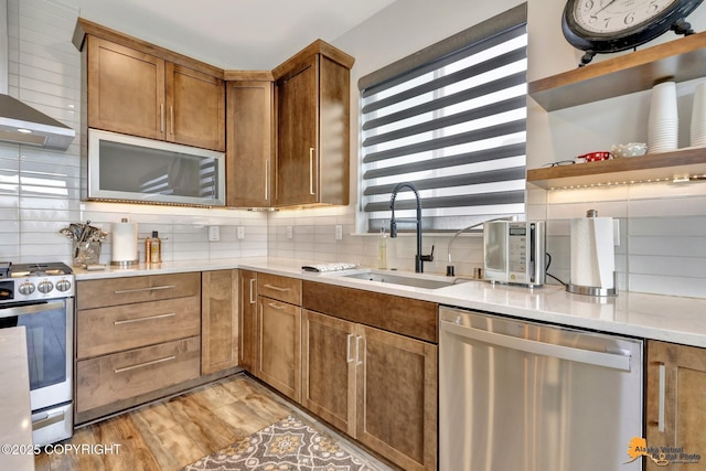 6033 Heather Wood Cir, Anchorage, AK 99502 - kitchen with stainless steel appliances, a sink, backsplash, and open shelves