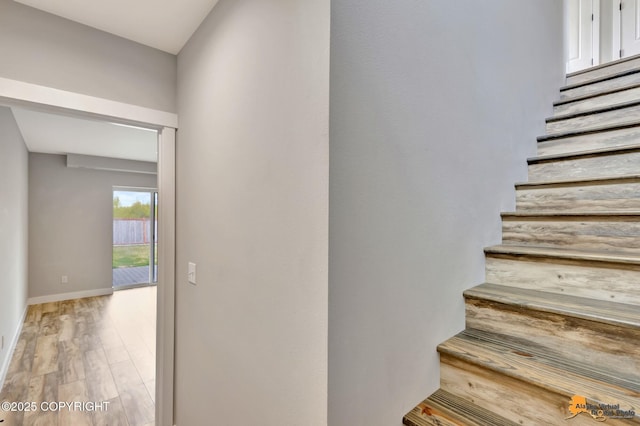 6033 Heather Wood Cir, Anchorage, AK 99502 - staircase featuring wood finished floors and baseboards