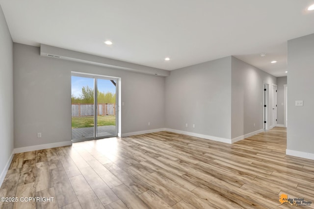6033 Heather Wood Cir, Anchorage, AK 99502 - spare room featuring light wood-style floors, recessed lighting, and baseboards