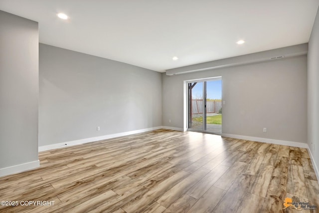 6033 Heather Wood Cir, Anchorage, AK 99502 - unfurnished room featuring light wood finished floors, baseboards, and recessed lighting