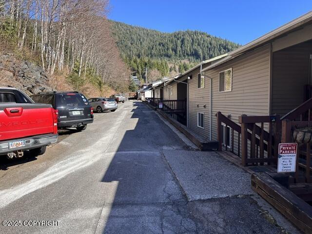 3220 Timberline Ct # 206, Ketchikan, AK 99901 - view of street featuring a mountain view and a forest view