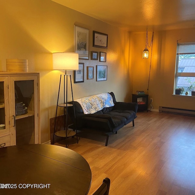 3220 Timberline Ct # 206, Ketchikan, AK 99901 - living area with wood finished floors and a baseboard heating unit