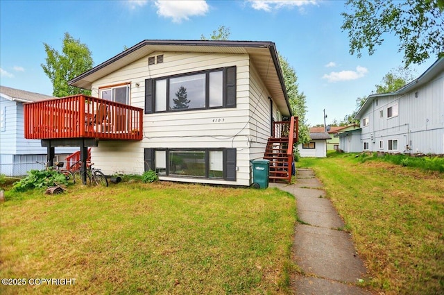 4109 Garfield St, Anchorage, AK 99503 - back of property featuring stairway, a yard, and a wooden deck