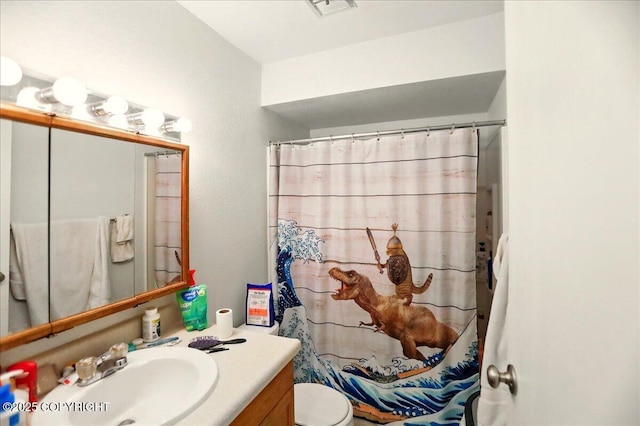 4109 Garfield St, Anchorage, AK 99503 - bathroom featuring vanity, toilet, and a shower with curtain