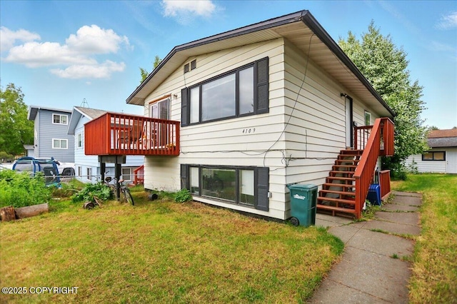 4109 Garfield St, Anchorage, AK 99503 - back of property featuring a yard and a wooden deck