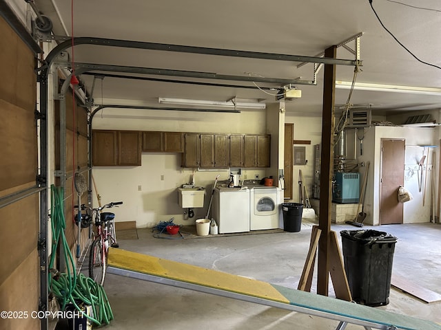 315 On Par Ln, Soldotna, AK 99669 - garage featuring washer and dryer, a sink, and a garage door opener