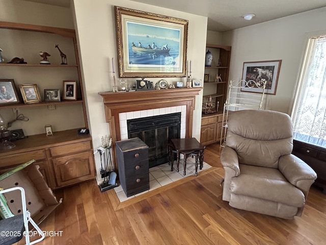 315 On Par Ln, Soldotna, AK 99669 - living area featuring light wood finished floors and a tile fireplace