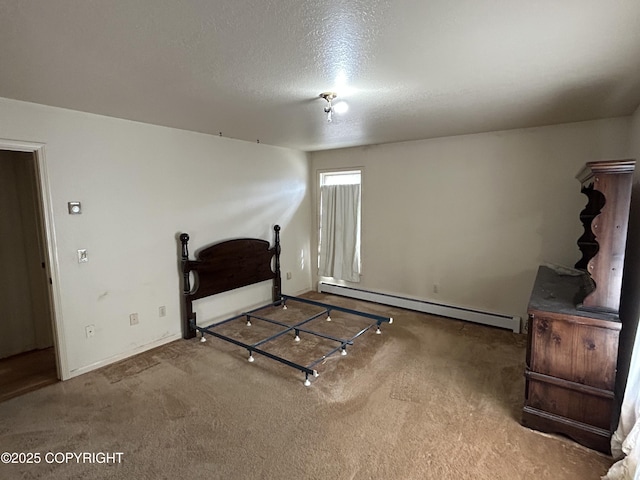 315 On Par Ln, Soldotna, AK 99669 - unfurnished bedroom featuring a baseboard heating unit, a textured ceiling, carpet floors, and baseboards