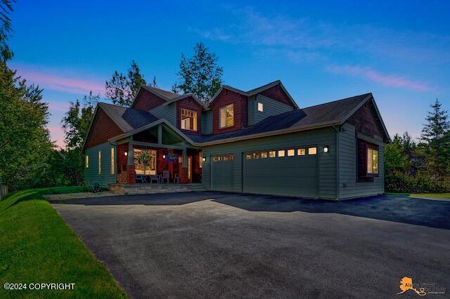 2923 Captain Cook Estates Cir, Anchorage, AK 99517 - craftsman-style home with driveway and a garage