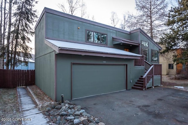 19404 Middleton Loop, Eagle River, AK 99577 - view of front of home with a garage, fence, and driveway