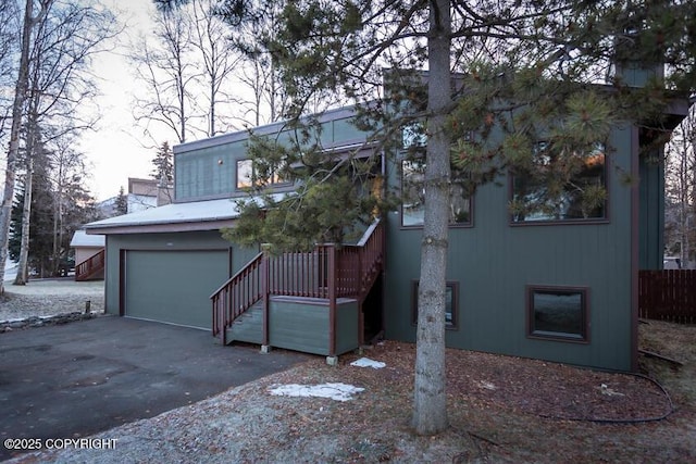 19404 Middleton Loop, Eagle River, AK 99577 - view of front of home with a garage, driveway, and stairway