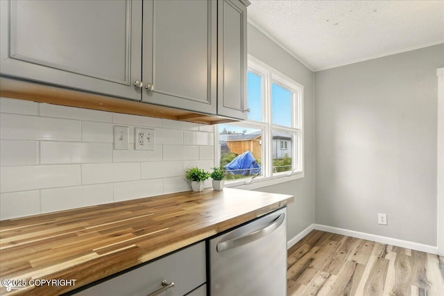 3624 E 16th Ave, Anchorage, AK 99508 - kitchen with dishwasher, gray cabinets, butcher block counters, and a textured ceiling