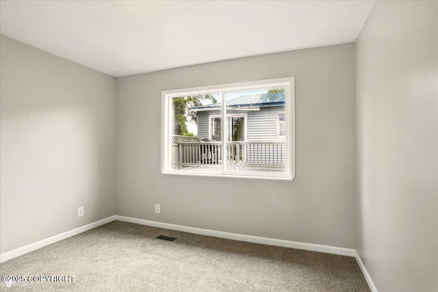 3624 E 16th Ave, Anchorage, AK 99508 - carpeted spare room featuring baseboards